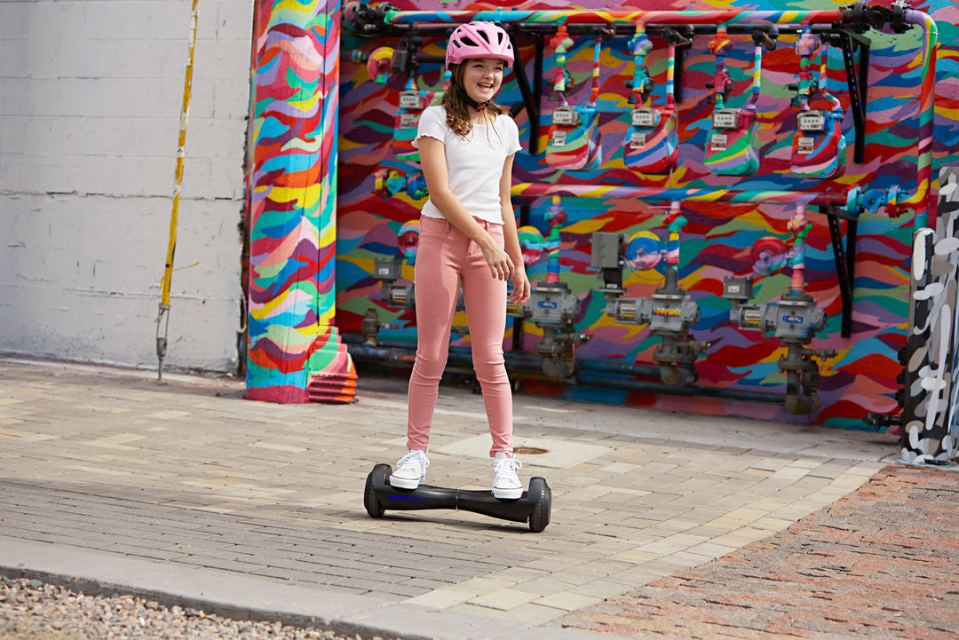 Child riding a GOTRAX Fluxx FX3 LED Hoverboard for Kids